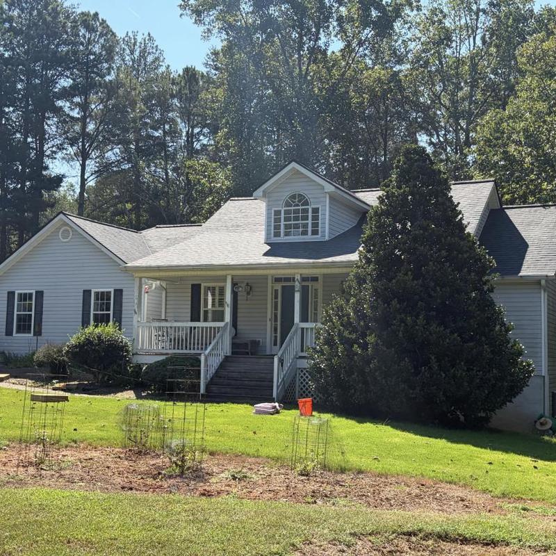 Architectural asphalt shingle roof on residential home Architectural asphalt shingle roof on residential home