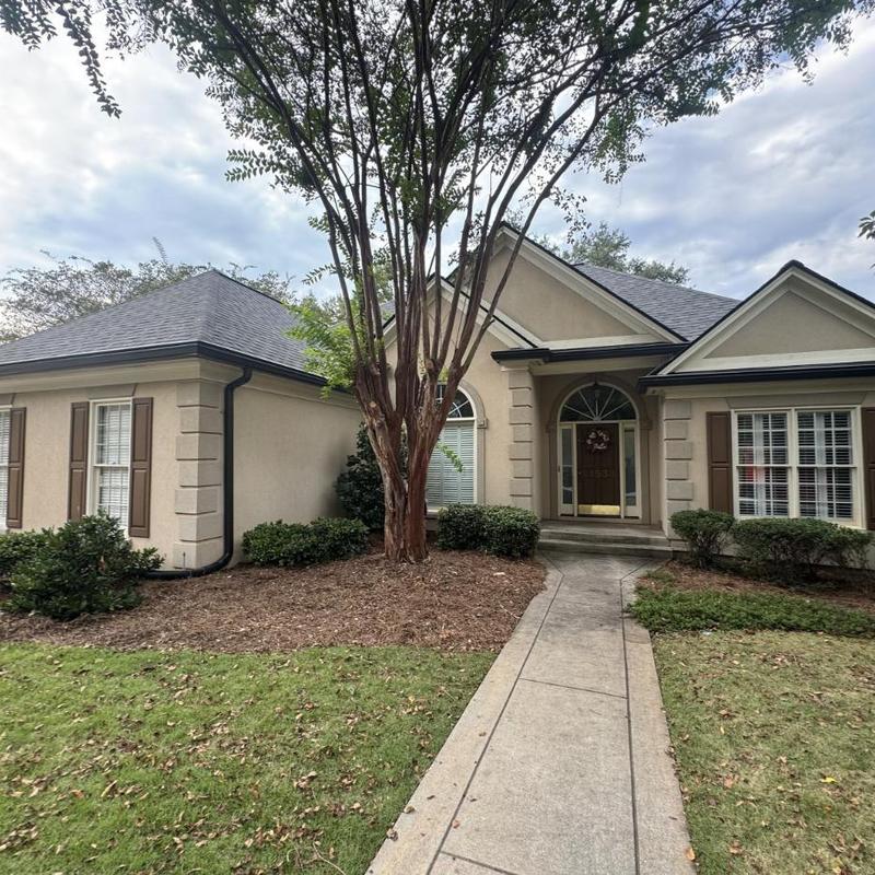 Architectural asphalt shingle roof and gutters on home Architectural asphalt shingle roof and gutters on home