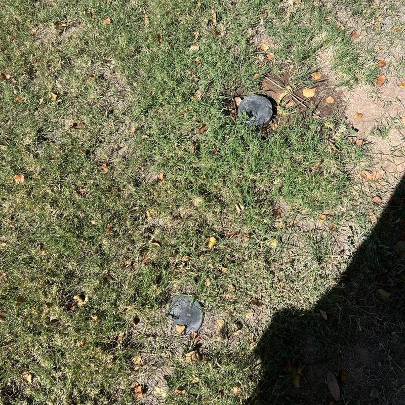 Main sewer line cleanouts in residential yard