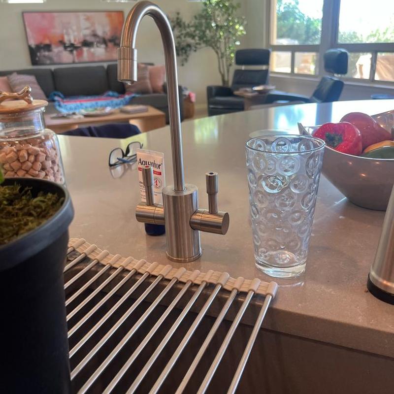 Reverse osmosis water filter faucet on kitchen counter