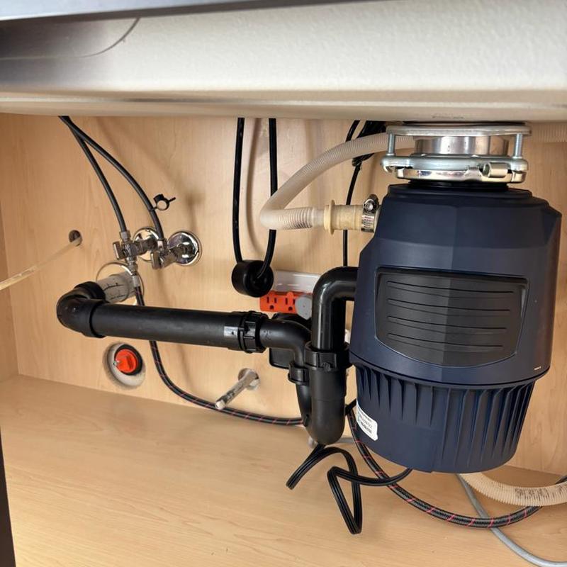 In-sink-erator garbage disposal and plumbing installation