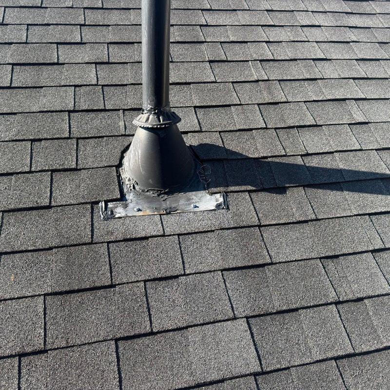 Pipe boot and vent flashing on asphalt shingle roof Pipe boot and vent flashing on asphalt shingle roof