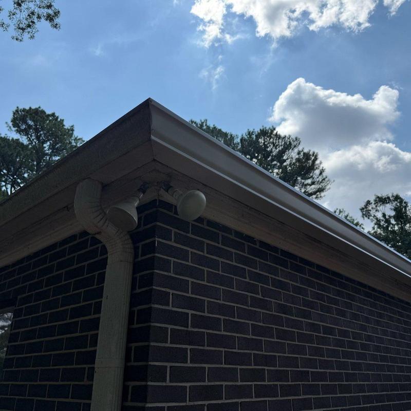 Roof ridge and shingle replacement on brick building Roof ridge and shingle replacement on brick building