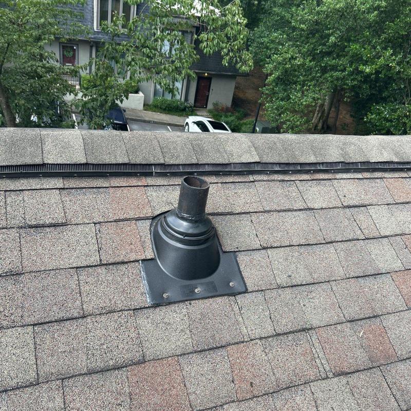 Pipe boot on asphalt shingle roof with sealant repairs Pipe boot on asphalt shingle roof with sealant repairs