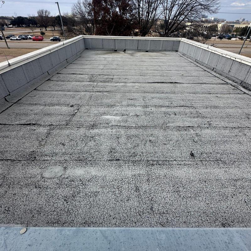Commercial flat roof surface showing hail damage inspection Commercial flat roof surface showing hail damage inspection