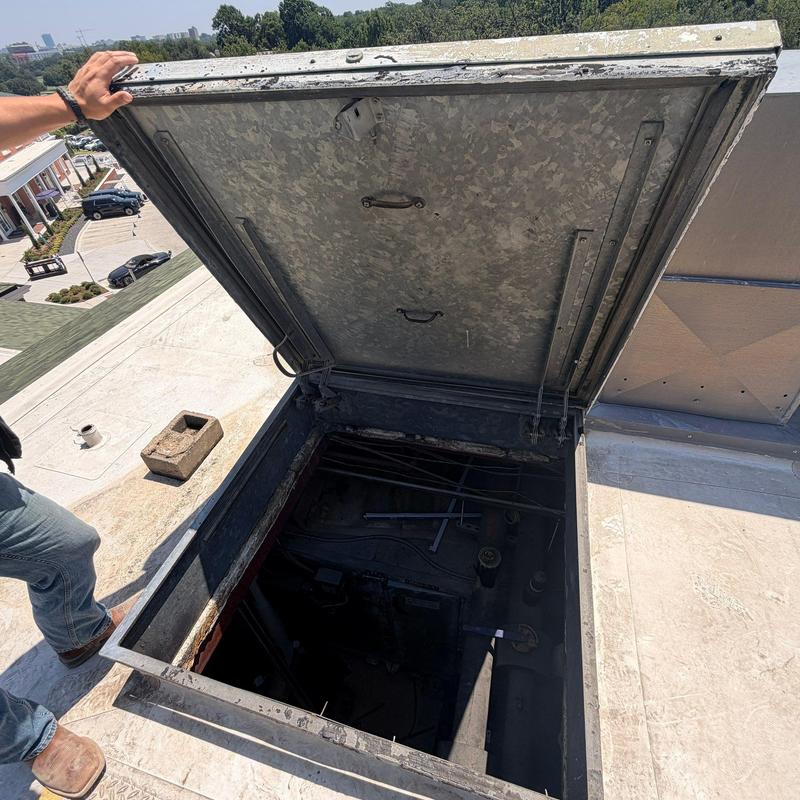 Rooftop hatch and access panel open for inspection Rooftop hatch and access panel open for inspection