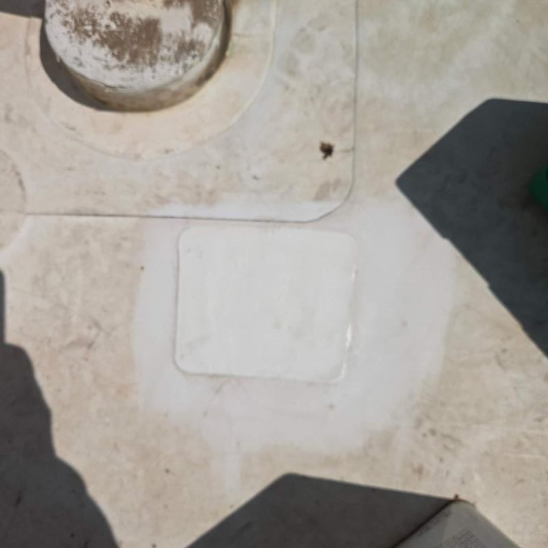 Roof membrane patch on commercial flat roof surface Roof membrane patch on commercial flat roof surface