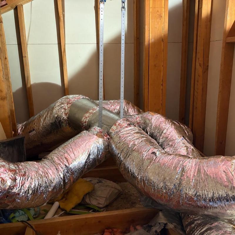 Flexible HVAC ductwork installation in attic space Flexible HVAC ductwork installation in attic space