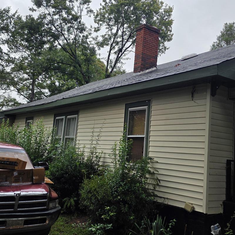 Chimney flashing and roof inspection on house exterior Chimney flashing and roof inspection on house exterior