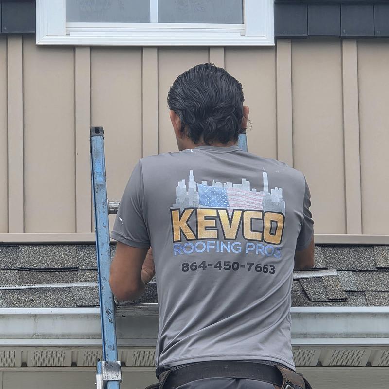 Asphalt shingle roof inspection with worker on ladder Asphalt shingle roof inspection with worker on ladder