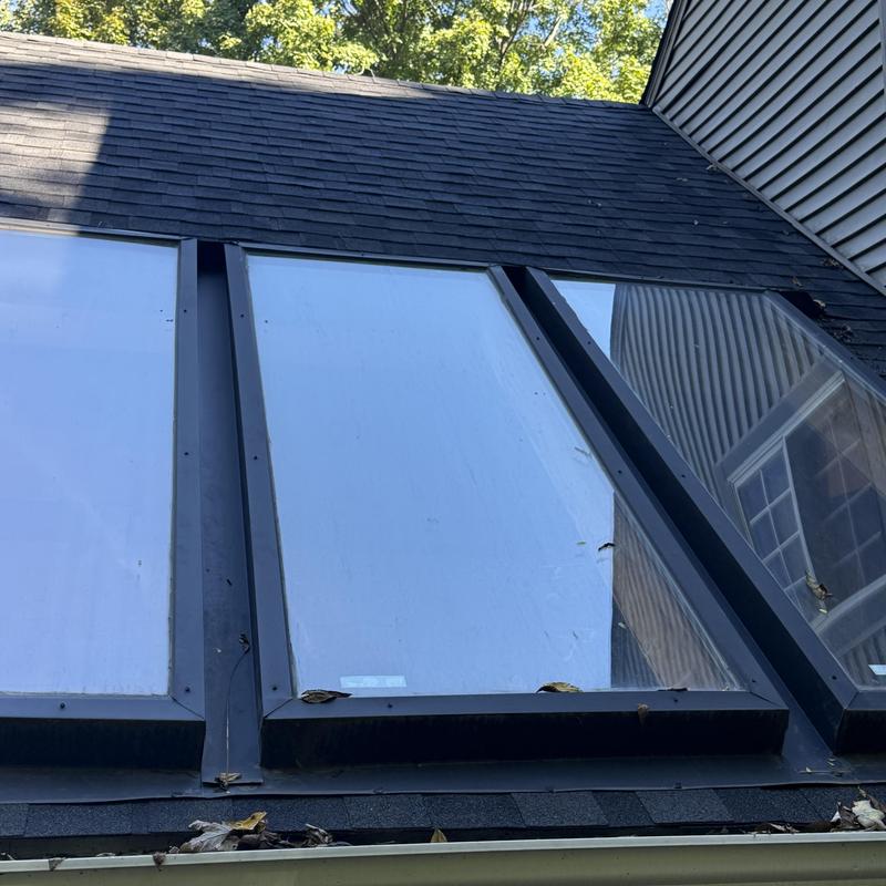 Skylight panels and flashing on pitched roof