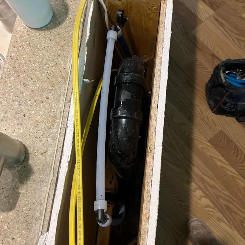 ABS drain and waterline reroute under countertop installation
