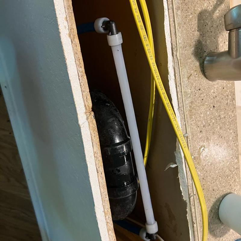 Boston loop vent line rerouted under countertop in Florence, AZ