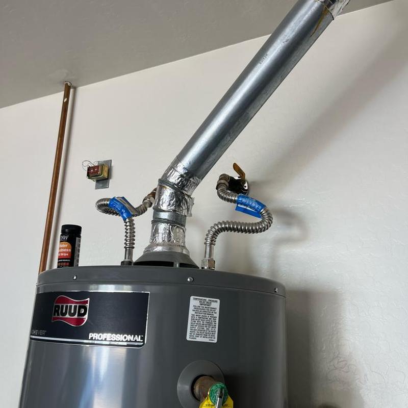 Gas water heater with vent and flex lines installed