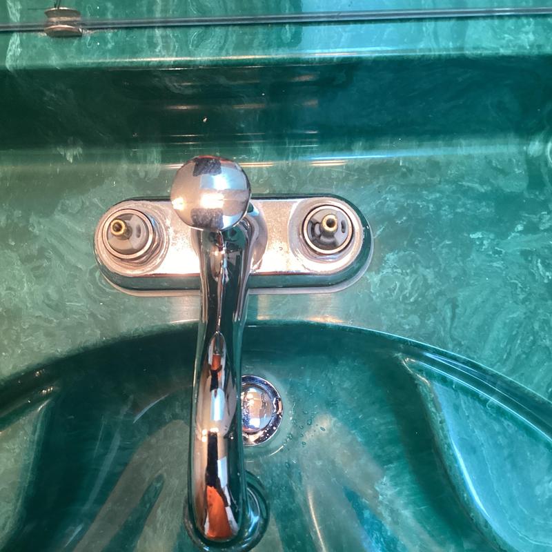 Double vanity faucet with removed cartridges and seats Double vanity faucet with removed cartridges and seats