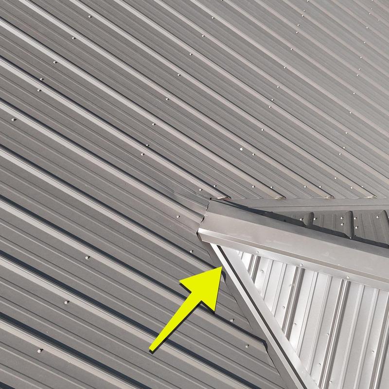 Metal roof hail damage at roof edge flashing joint