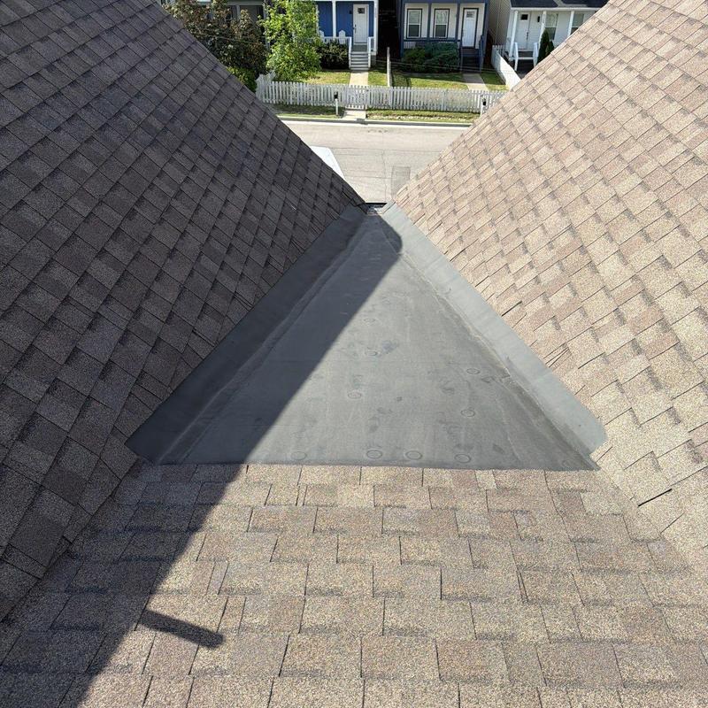Roof valley with new rubber flashing installation