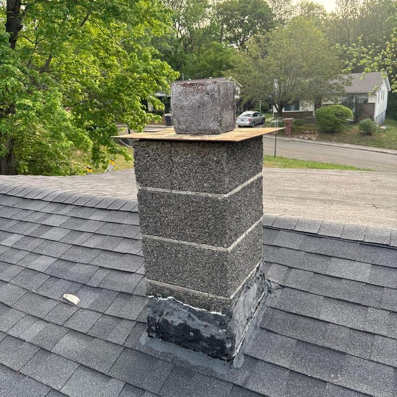 Chimney flashing and cap on asphalt shingle roof