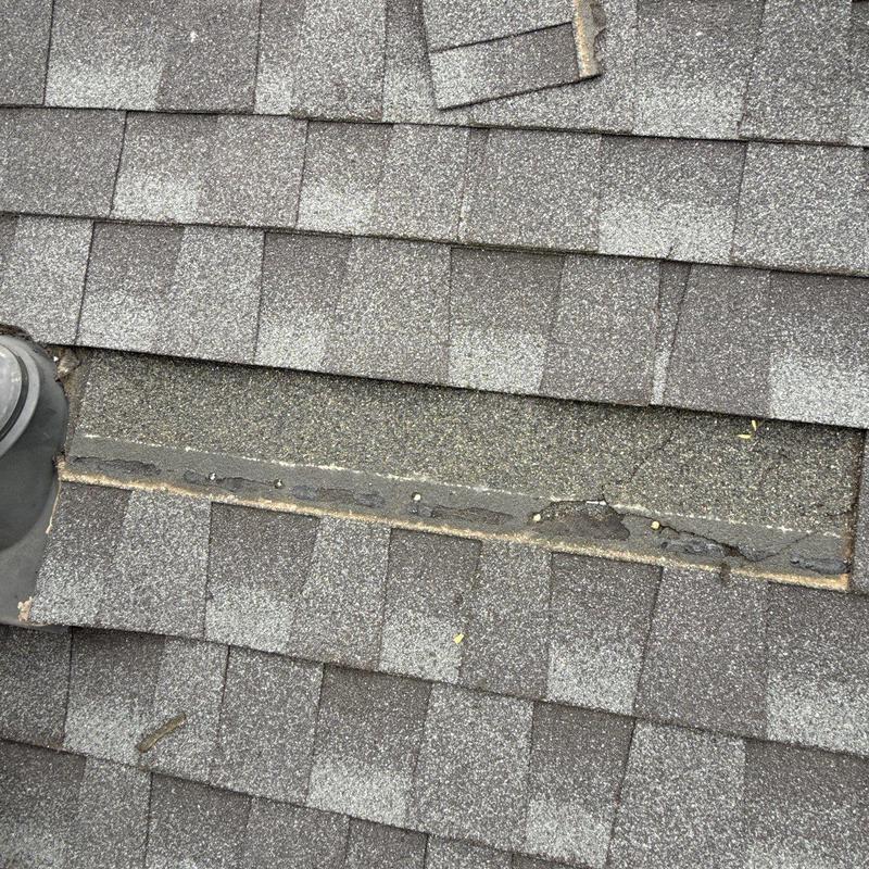 Roof shingles with cracked sealant and wear