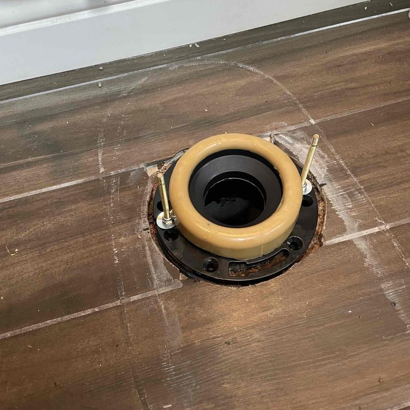 Toilet closet flange with new wax seal installed