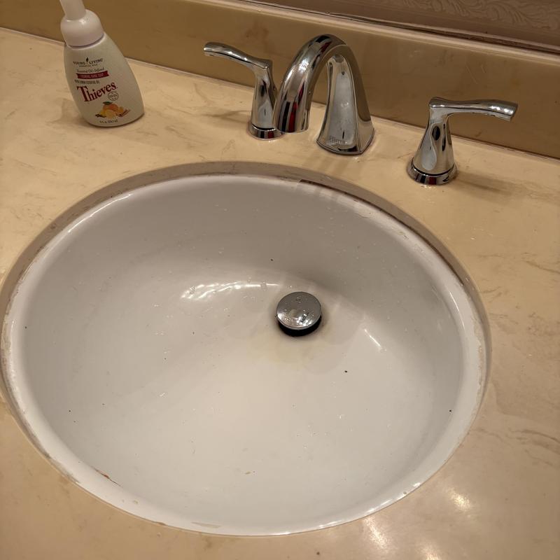 Bathroom faucet and sink installed on marble countertop