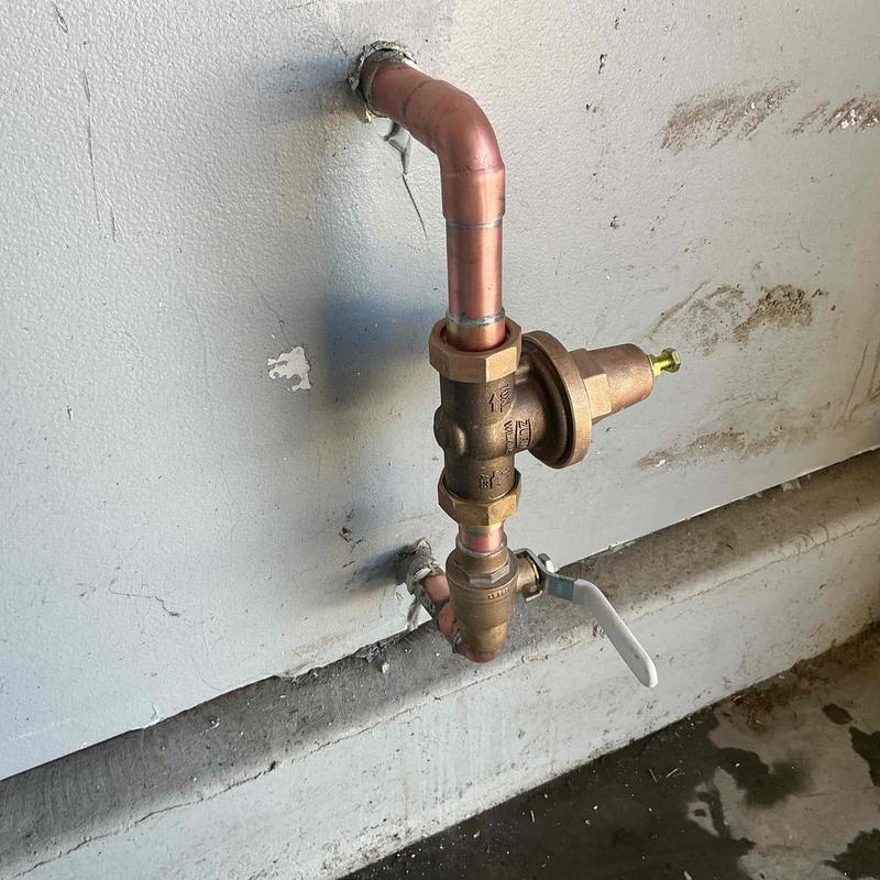 1-inch pressure regulator with ball valve installed in wall