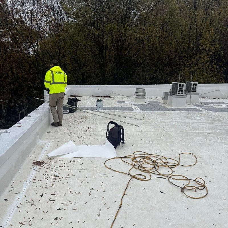 Commercial flat roof replacement with HVAC units visible Commercial flat roof replacement with HVAC units visible