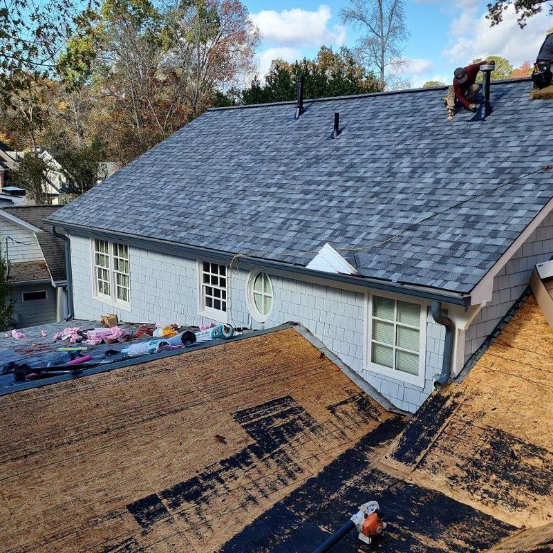 Asphalt shingle roof replacement with new underlayment Asphalt shingle roof replacement with new underlayment