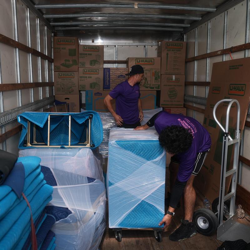 Furniture packing and loading inside moving truck