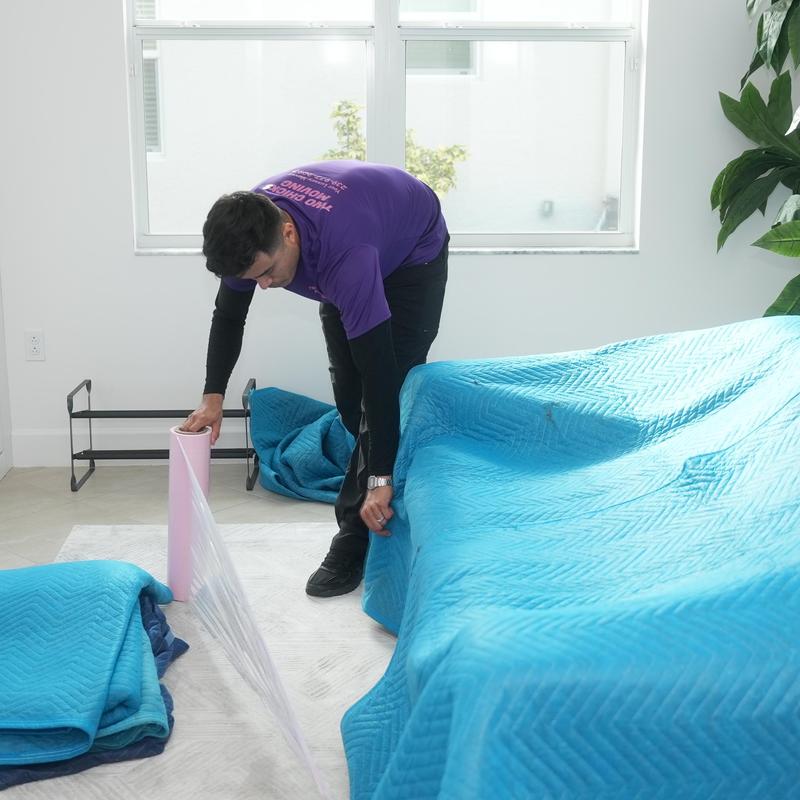 Moving blankets and plastic wrap for furniture packing
