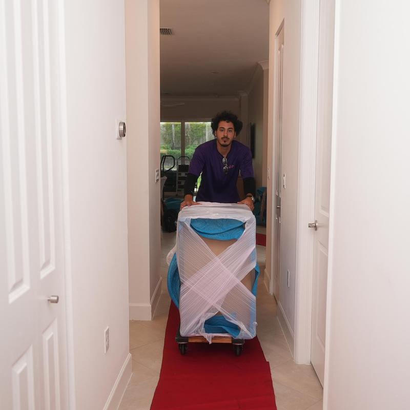 Furniture dolly with wrapped chair during local move