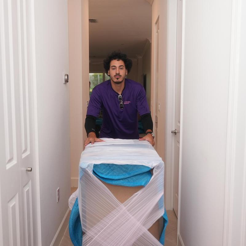 Furniture wrapped in protective blankets during local move