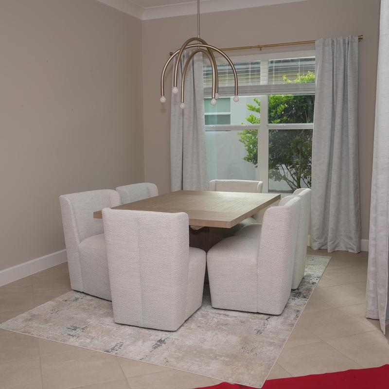 Dining table and chairs setup in modern room