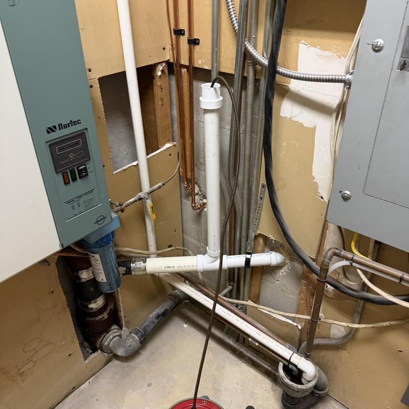 Main line PVC plumbing with pressure system components Main line PVC plumbing with pressure system components