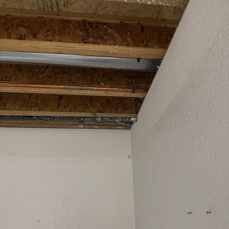 Copper water pipe with exposed ceiling joists