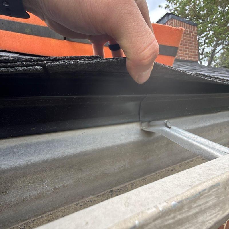 Roof shingles and drip edge inspection on gutter line