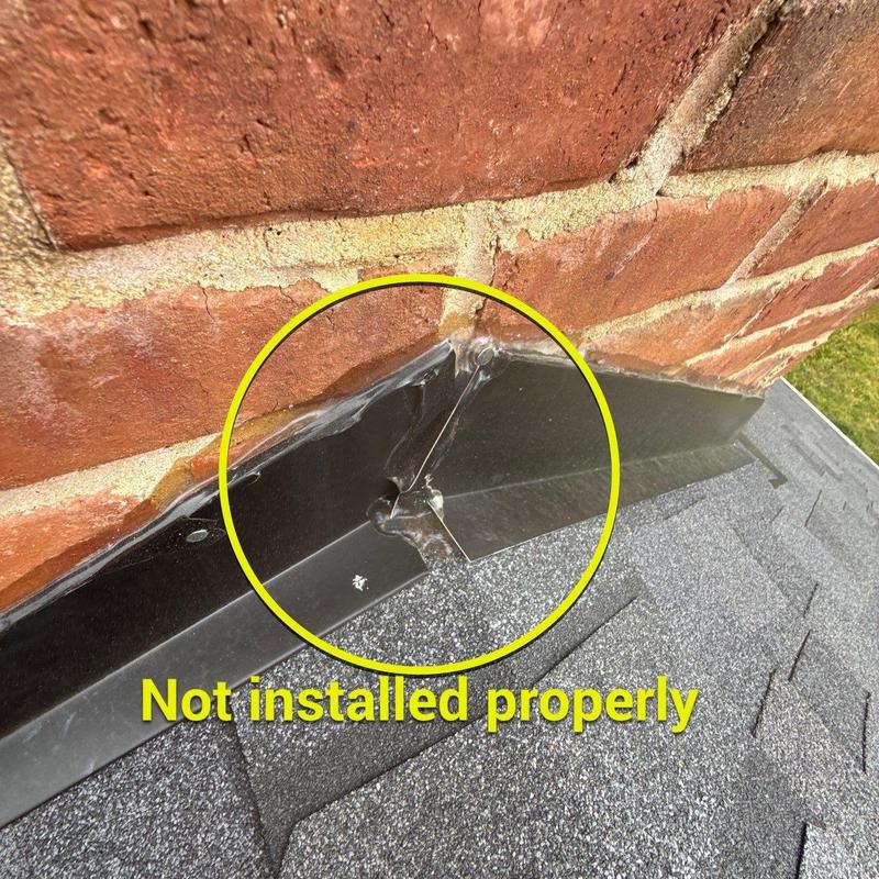 Metal flashing at brick chimney not installed properly