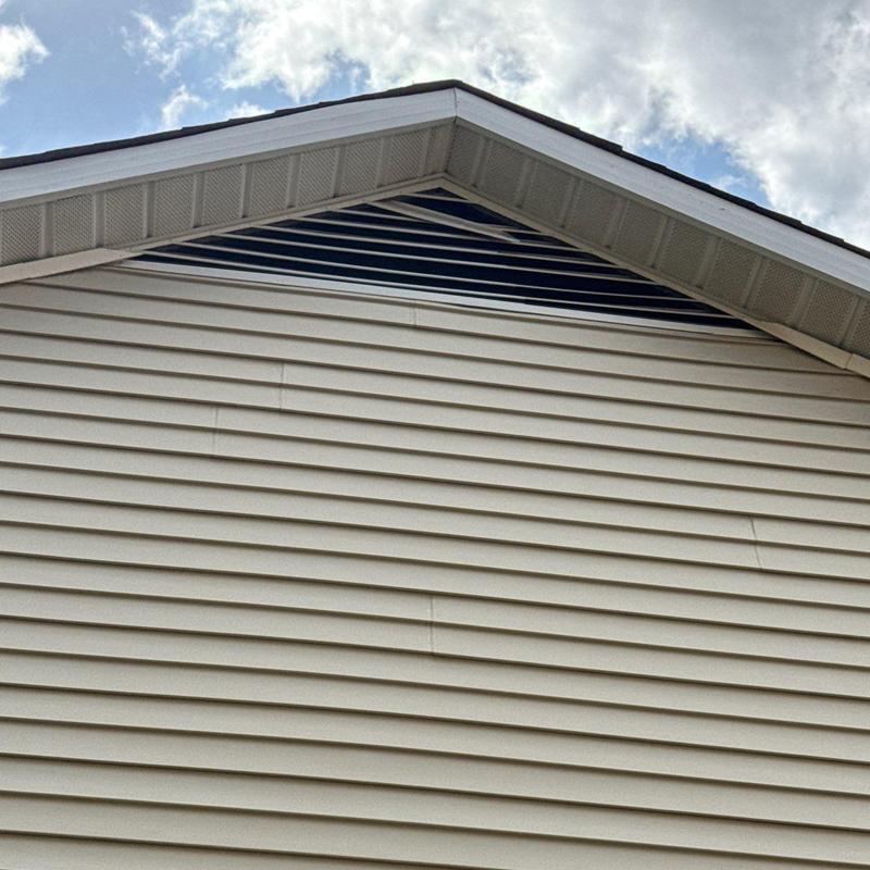 Roof soffit ventilation and siding on building exterior