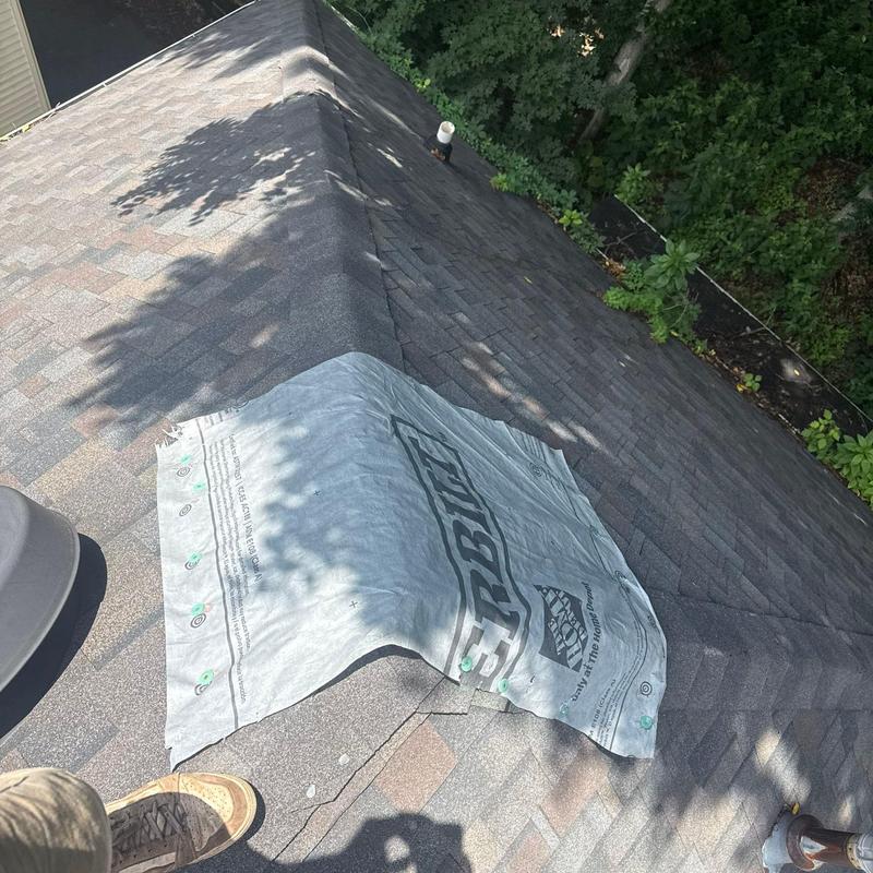 Roofing underlayment laid on shingled roof slope