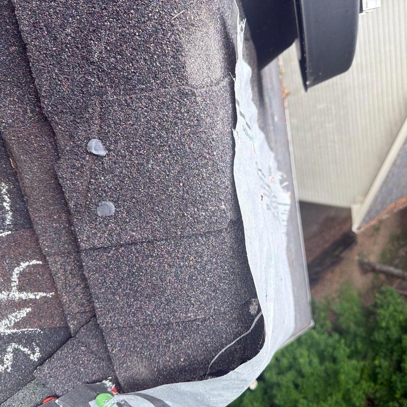 Asphalt shingle roof with exposed underlayment edge