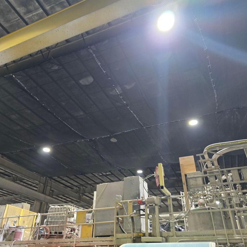 Industrial roof support structure with lighting and machinery Industrial roof support structure with lighting and machinery