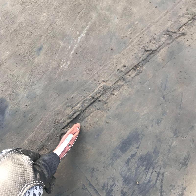Commercial roof seam damage with inspection tool Commercial roof seam damage with inspection tool