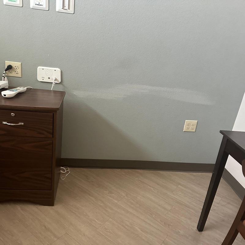 Wall electrical outlets and cords near wooden furniture Wall electrical outlets and cords near wooden furniture