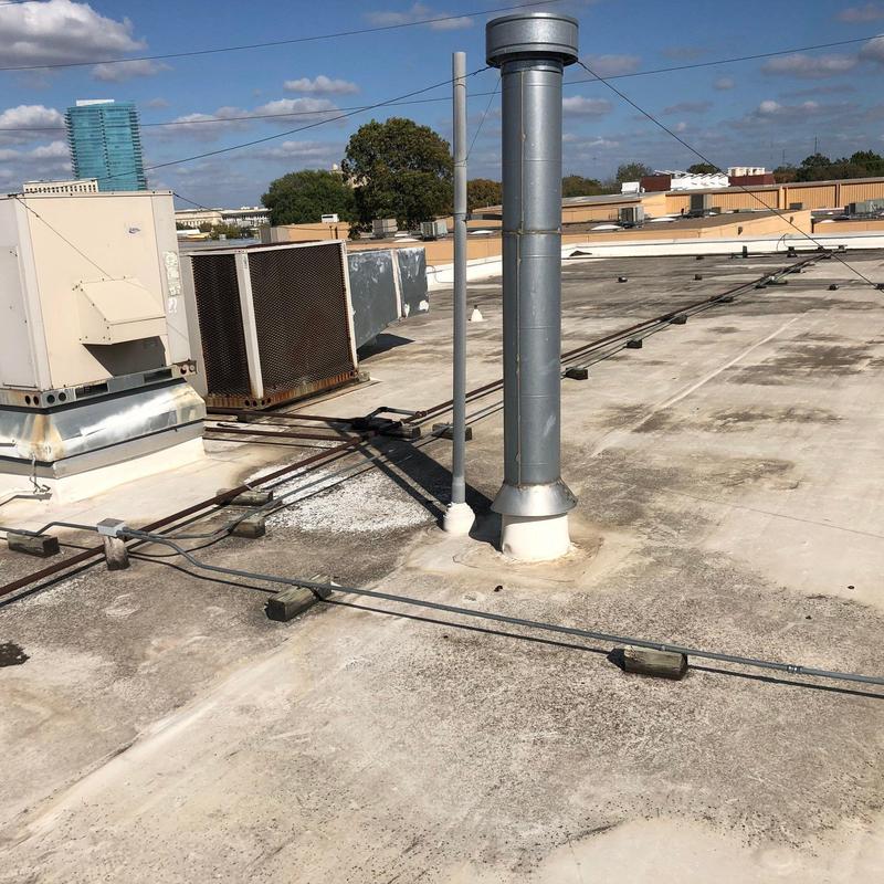 Commercial roof vent pipe and HVAC units on roof Commercial roof vent pipe and HVAC units on roof