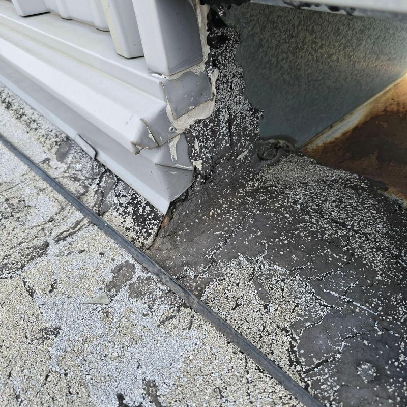 Roof flashing with sealant deterioration and damage Roof flashing with sealant deterioration and damage