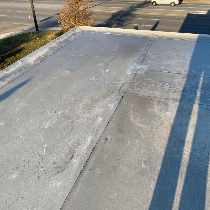 Commercial flat roof membrane inspection with wear marks Commercial flat roof membrane inspection with wear marks