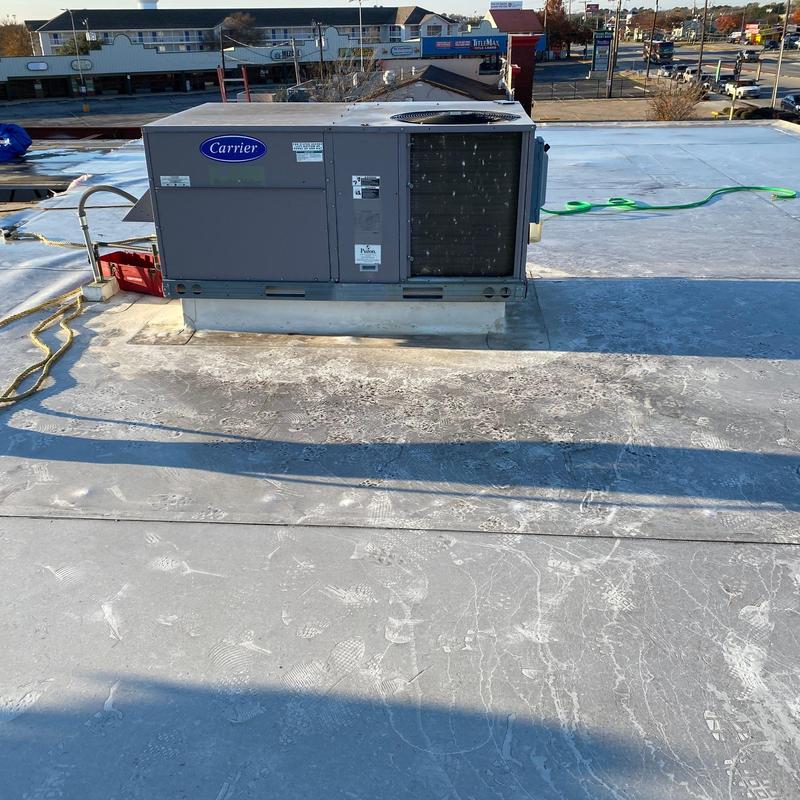 Rooftop Carrier HVAC unit on commercial roof Rooftop Carrier HVAC unit on commercial roof