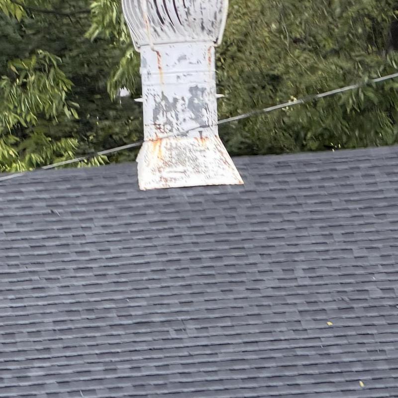 Rusty roof ventilation turbine on shingled roof Rusty roof ventilation turbine on shingled roof