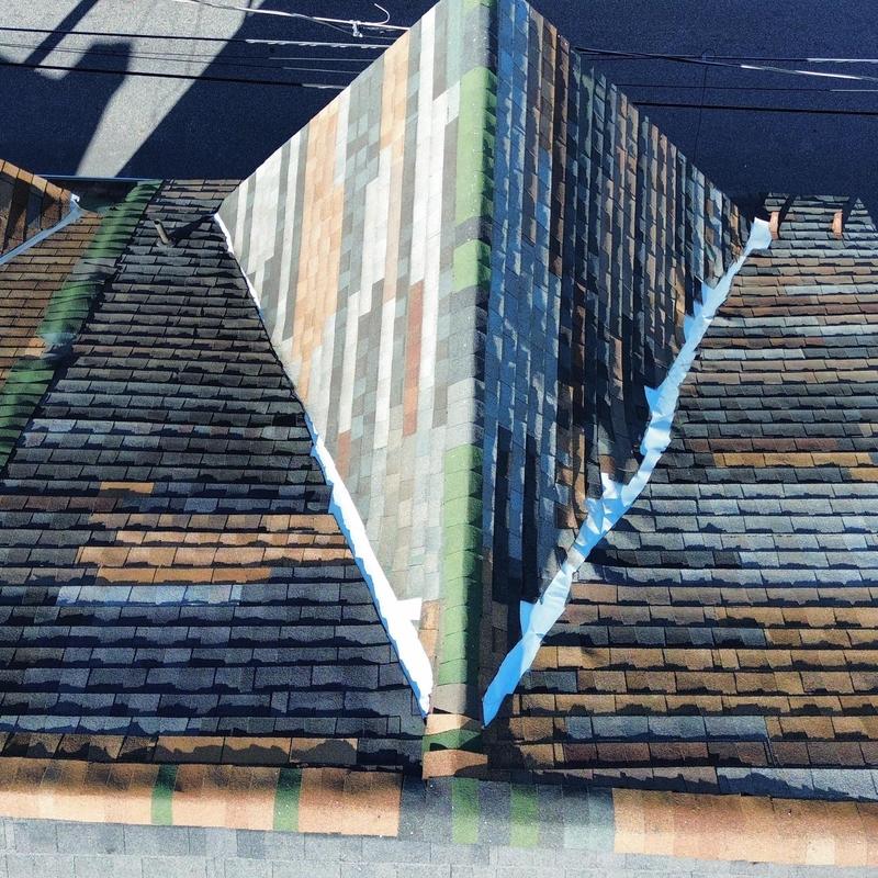 Architectural shingle roofing with chimney flashing detail Architectural shingle roofing with chimney flashing detail