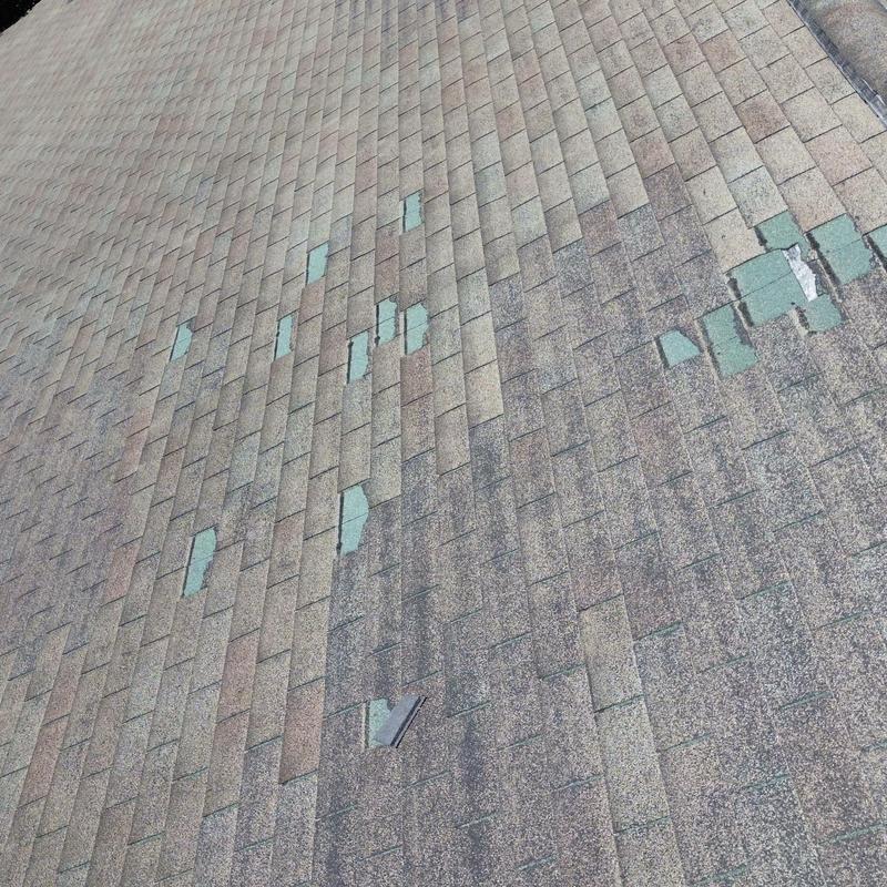Three tab roof shingles with storm damage Three tab roof shingles with storm damage